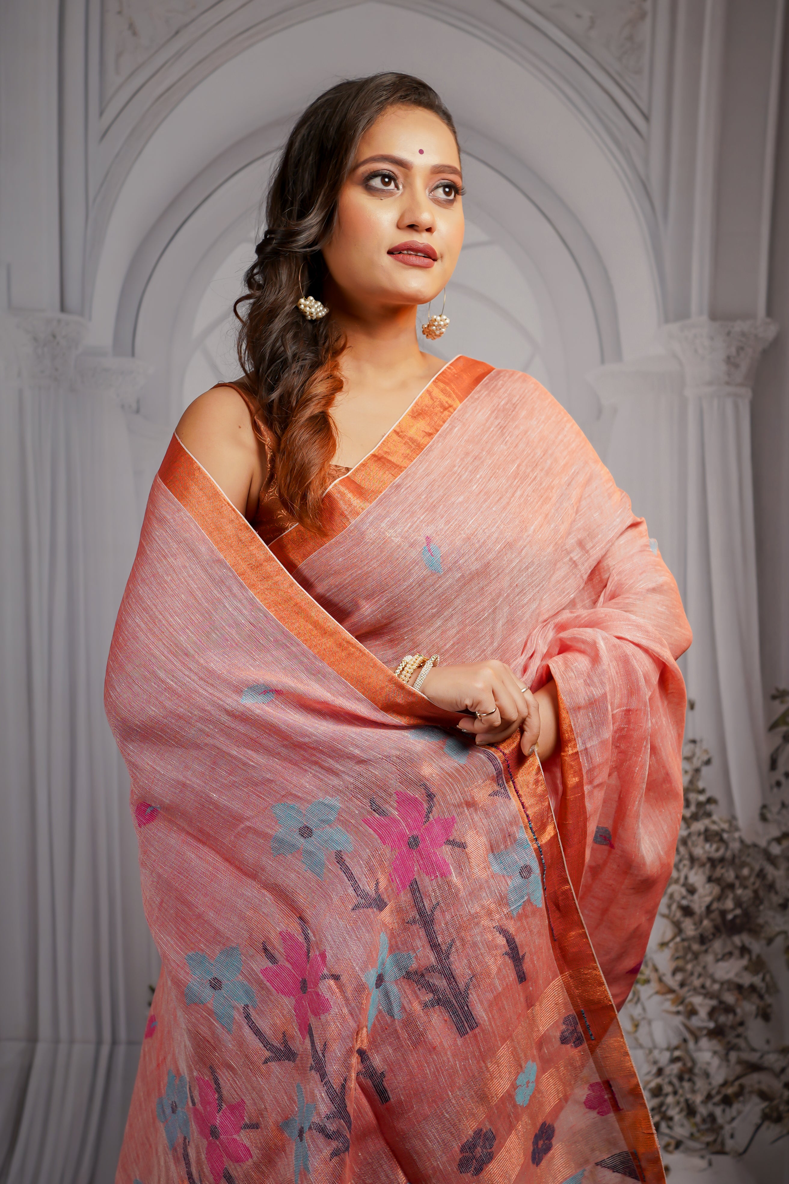 Blashing peach pure linen handwoven jamdani saree